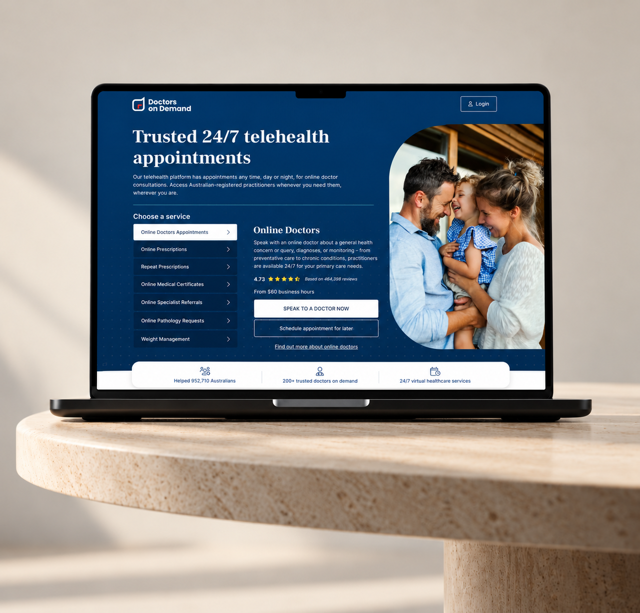 Doctors on Demand homepage displayed on a laptop on a warm stone table.